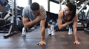 Sculpting Sleek Arms: The Essential Role of Cardio in Toning Without Bulking Up 1 Image of man and woman doing Cardio West Thurrock to tone their arms.